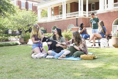 Students spend time on a beautiful day on Front Campus