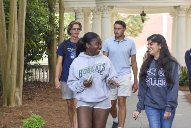 Students walking on Front Campus near the pergola