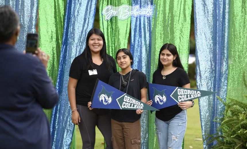 Students pose for a photo at the photo booth