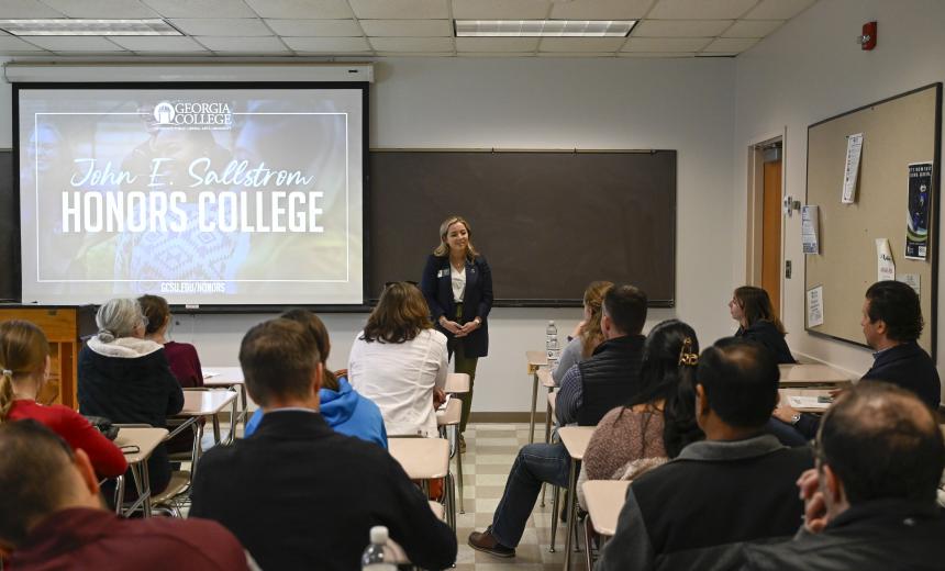 An admissions leader presents information at Junior Day